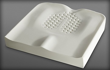 Top view image of the Premium general-use Axiom G wheelchair cushion with pre-contoured shape and surface tension-reducing well.