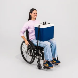 Image of a woman using the LapStacker Flex Manual Rigid Wheelchair Table - Portable, lightweight wheelchair table with adjustable height and tilt, designed for increased independence and productivity.