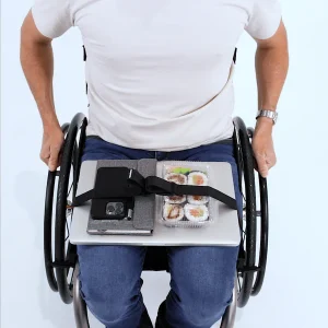 Image of a man using the LapStacker Flex Manual Rigid Wheelchair Table - Portable, lightweight wheelchair table with adjustable height and tilt, designed for increased independence and productivity.