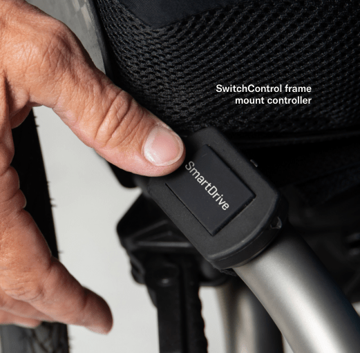 Close up Image of the Smartdrive MX2+ Powered Wheelchair Attachment - A motorized attachment unit that connects to a manual wheelchair, transforming it into a power-assisted wheelchair.