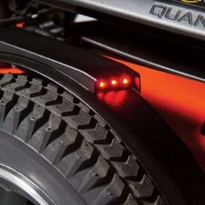 Image of the Quantum LED Fender Lights on wheelchair - Set of high-intensity LED lights designed for wheelchair fenders, providing improved visibility and safety during low-light conditions.