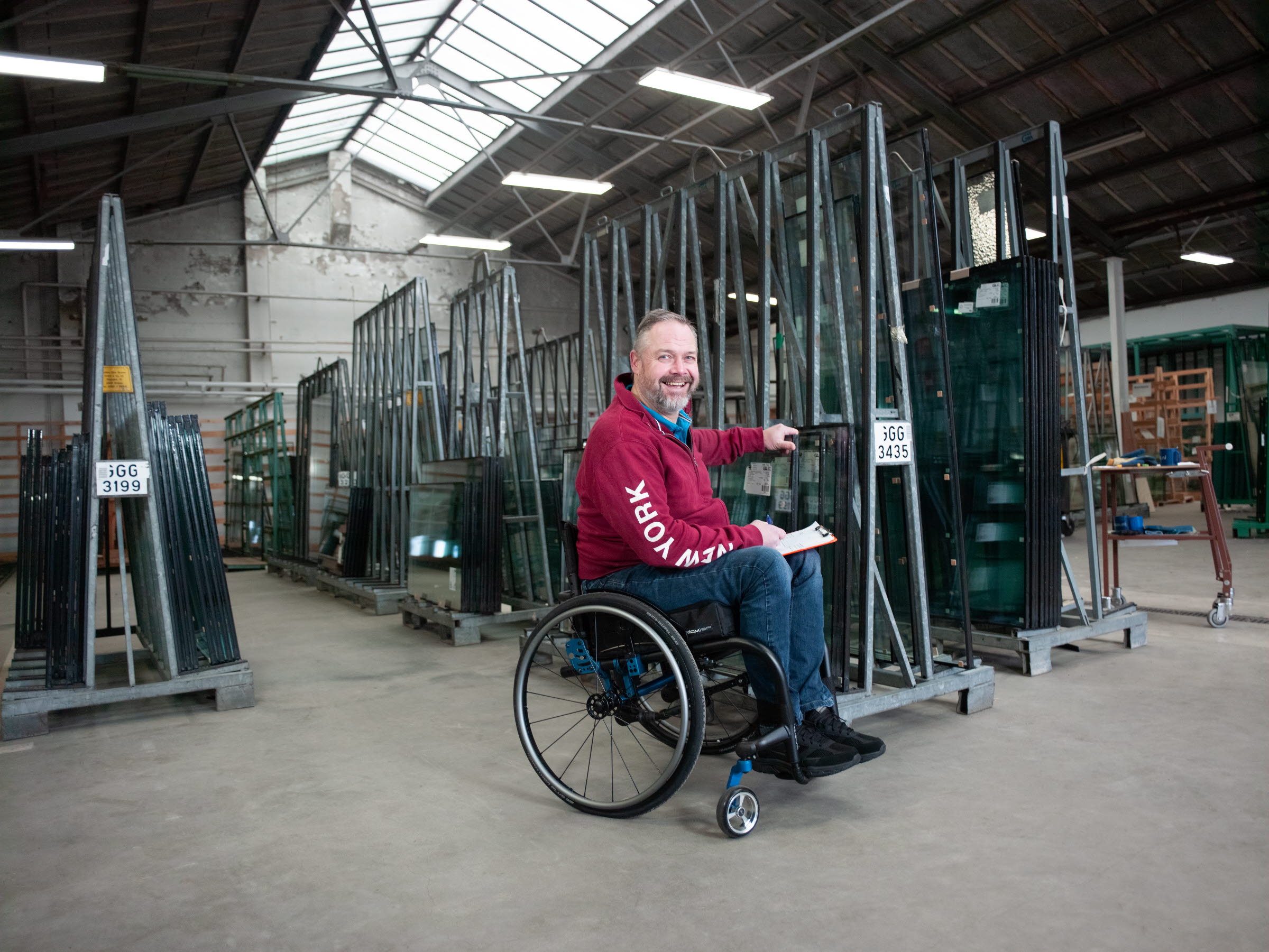 Image of a man utilizing the Ki Mobility Rogue 2 Wheelchair - Lightweight, high-performance manual wheelchair with a rigid frame, designed for increased stability and maneuverability.