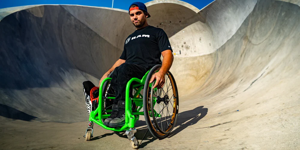 Image of an athlete on the Spinergy XSLX R10 Wheelchair Wheel - Lightweight, high-performance wheelchair wheel featuring a rigid spoke design for enhanced stability and maneuverability.