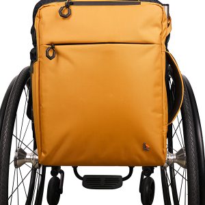 Frontal image of the yellow Backrest Commuter Backpack on wheelchair - Attaches securely to the backrest of a wheelchair, offering comfortable carrying and organized storage for everyday essentials during commutes or outings.