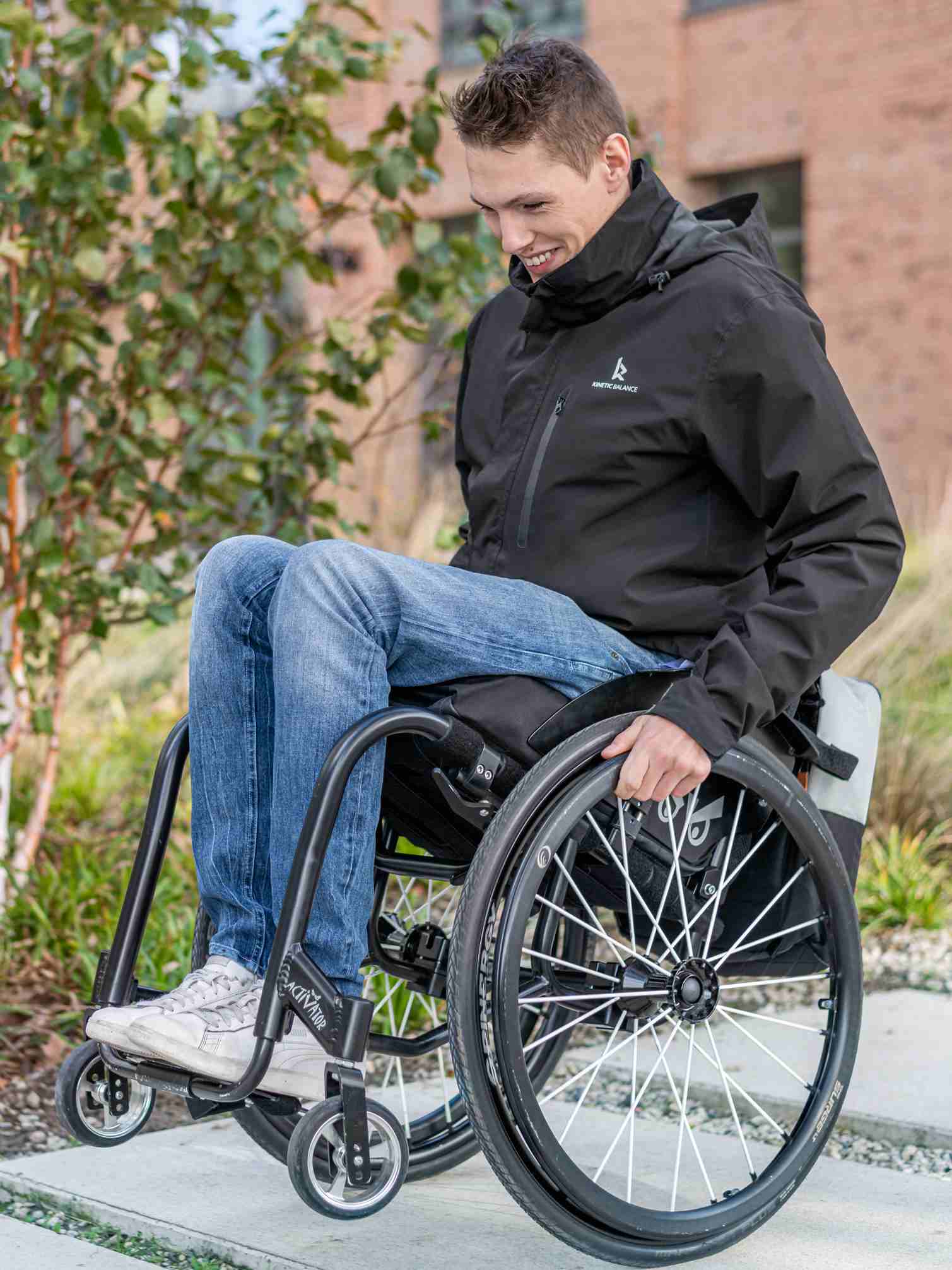 Image of a man happily wearing the Kinetic-Source 3:1 Magnetic Jacket - Supportive jacket with innovative magnetic closure system for easy dressing and enhanced independence, designed for individuals with limited mobility.