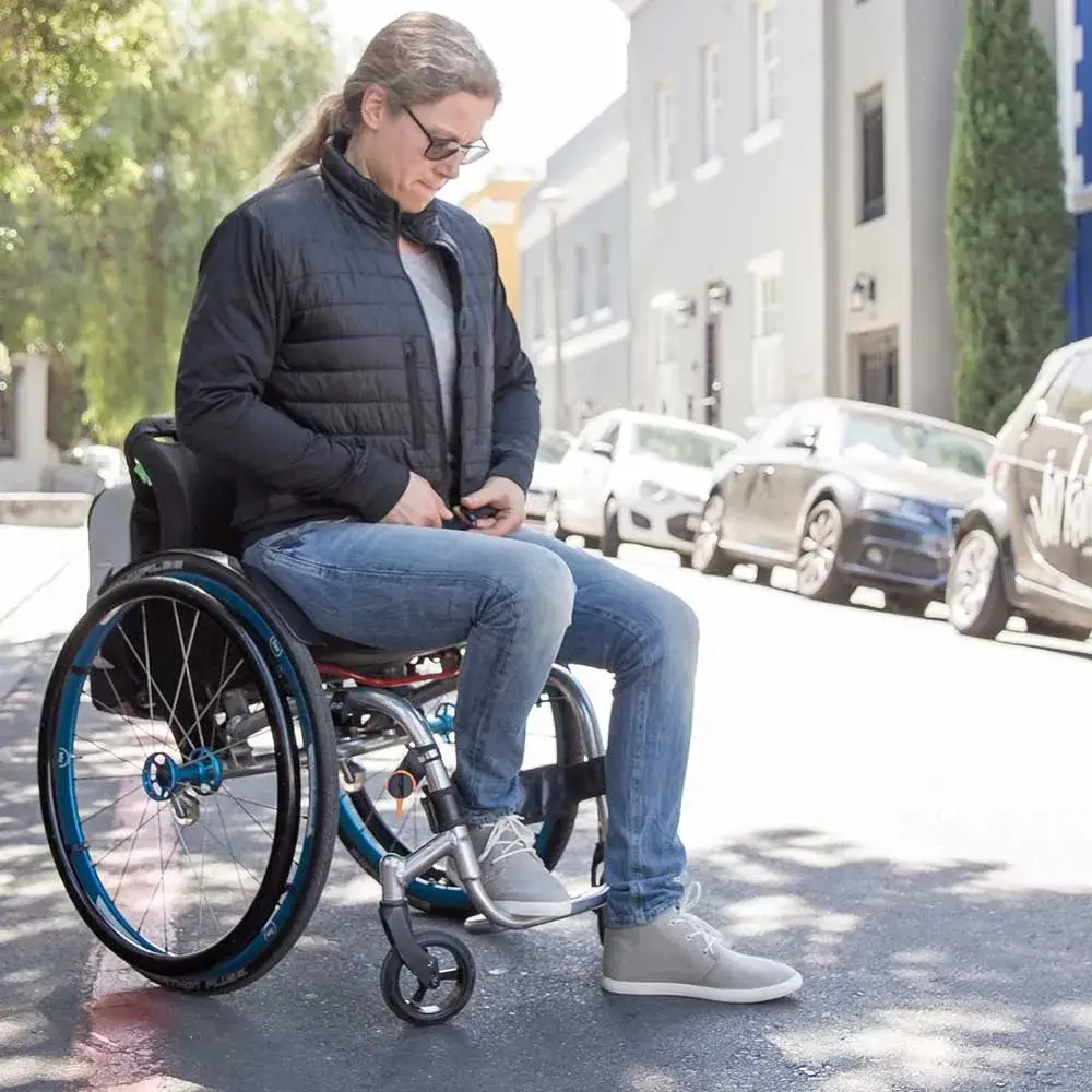 Image of a woman wearing the Kinetic Balance Women's Jeans - Adaptive jeans designed for wheelchair users, featuring adjustable waist and inseam for a comfortable and customizable fit.