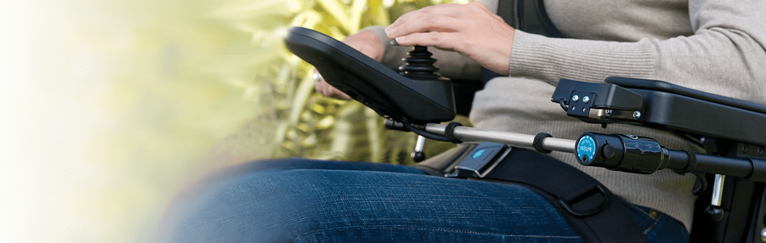 Image of Bodypoint U-Shaped Handle being utilized on wheelchair.