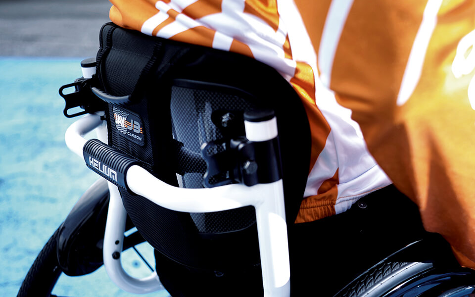 Image of an athletic man using the Jay J3 Carbon Fiber Backrest - Lightweight, adjustable wheelchair backrest with a carbon fiber shell for optimal support, posture, and comfort.