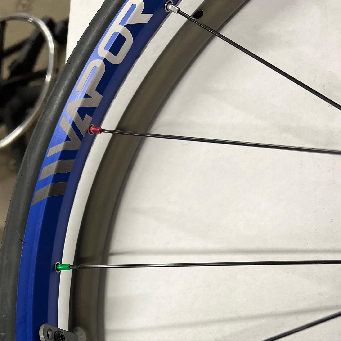 Close up image of the Vapor X Wheel Set - Lightweight and responsive wheelchair wheels designed for speed and maneuverability, featuring a sleek aerodynamic design and high-performance tires.