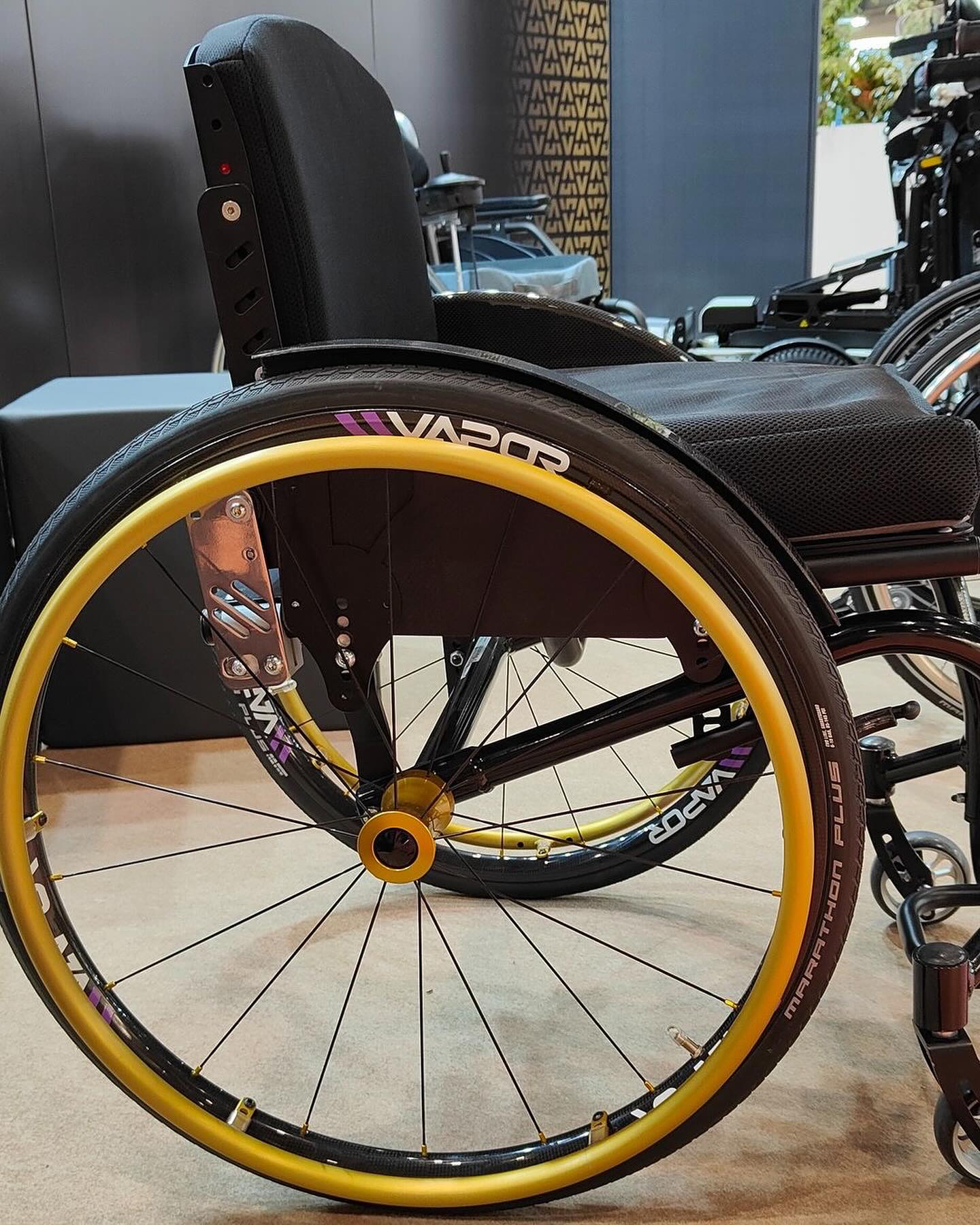 Image of the Vapor X Wheel Set on ground - Lightweight and responsive wheelchair wheels designed for speed and maneuverability, featuring a sleek aerodynamic design and high-performance tires.